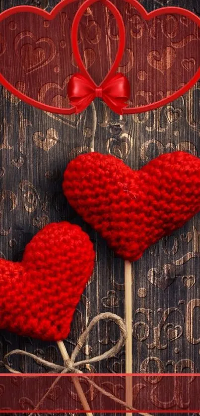 Romantic red heart wallpaper with knitted hearts on a wooden background.
