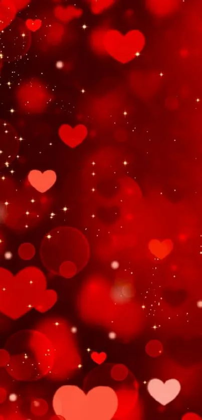 Romantic red heart wallpaper with glowing bokeh and sparkles.