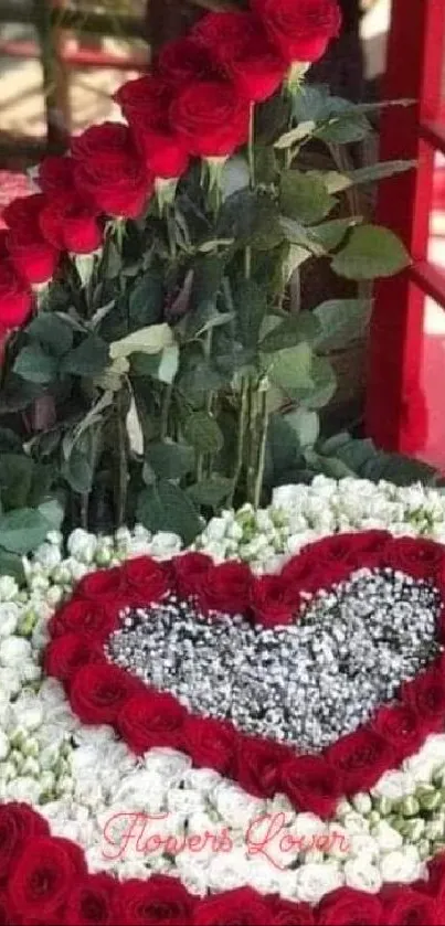 Heart-shaped red rose floral arrangement in a romantic display.