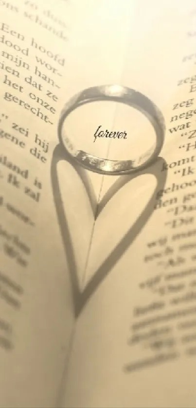 Ring casting heart-shaped shadow on book pages with 'forever' text.