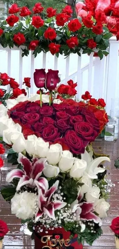 Beautiful bouquet with red and white roses, heart decorations.