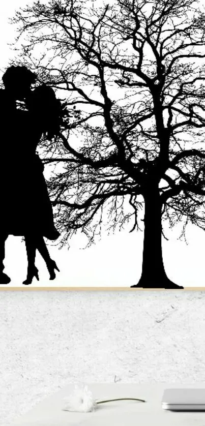 Silhouette art of a couple under a tree in black and white.