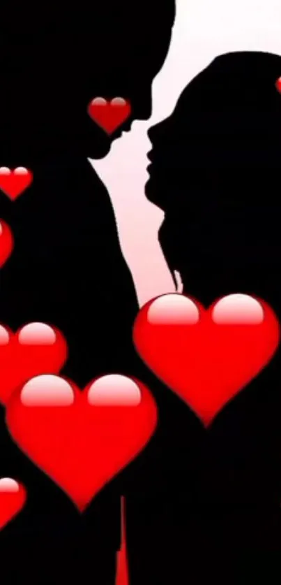 Silhouette couple with red heart shapes wallpaper.