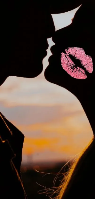 Silhouette of a couple kissing at sunset with a pink kiss mark.