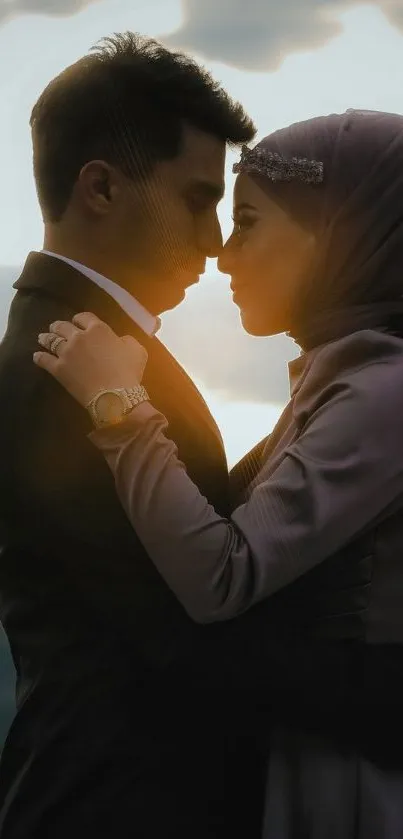 Silhouetted couple in a romantic mountain sunset scene.