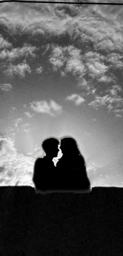 Romantic silhouette of a couple kissing at sunset.