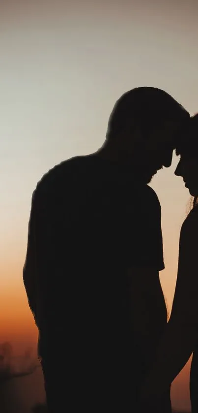 Silhouette of couple at sunset, romantic scene.