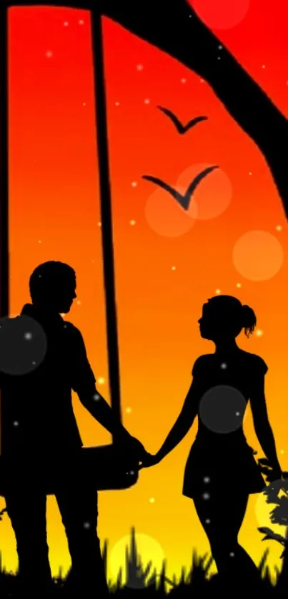 Silhouette of a couple at sunset with vivid orange and red hues.