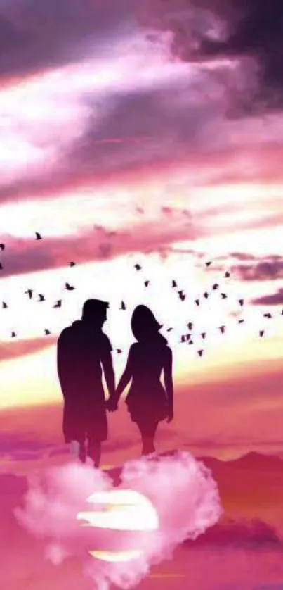 Silhouette of couple at pink sunset with birds and clouds.