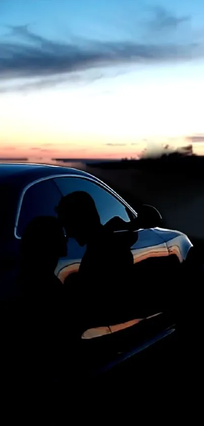 Silhouette of a couple with a romantic sunset background on a mobile wallpaper.