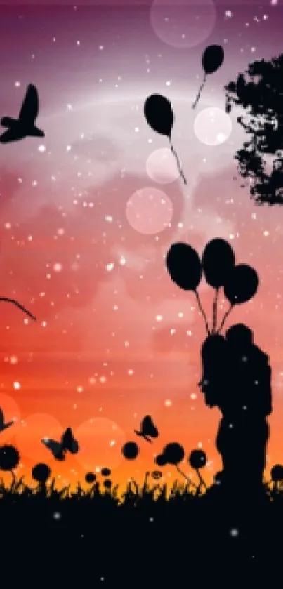 Silhouette of trees and balloons against an orange sunset sky.