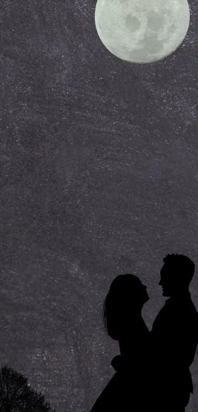 Silhouette of a couple under a bright full moon in a night sky wallpaper.