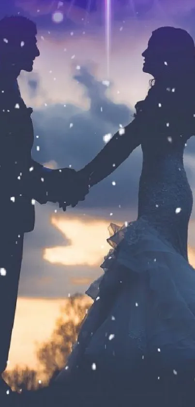 Romantic couple silhouette at sunset with falling snowflakes.