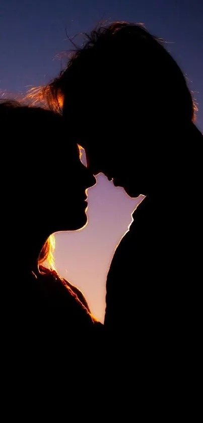 Silhouette of a couple at sunset in a romantic setting.