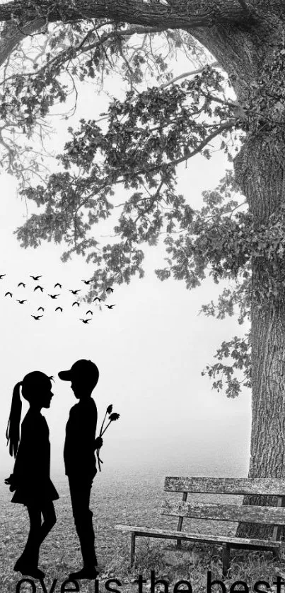 Romantic black and white wallpaper with a couple under a tree.