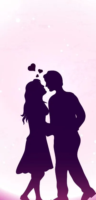 Silhouette of a couple in love against a pink background wallpaper.