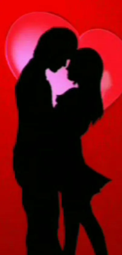 Silhouette of a couple in love on a red heart background.