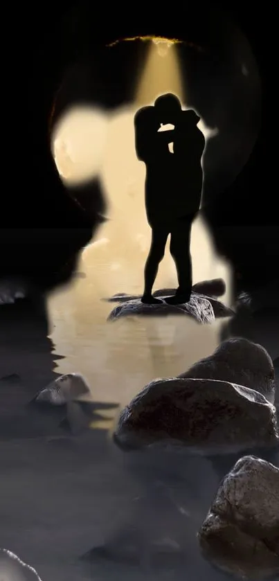 Silhouette of couple embracing on rocks in the water at dusk.