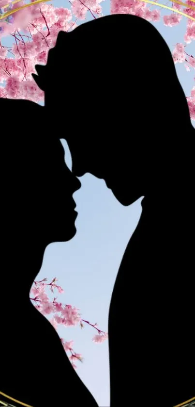Silhouette of a couple with cherry blossoms and a blue sky background.