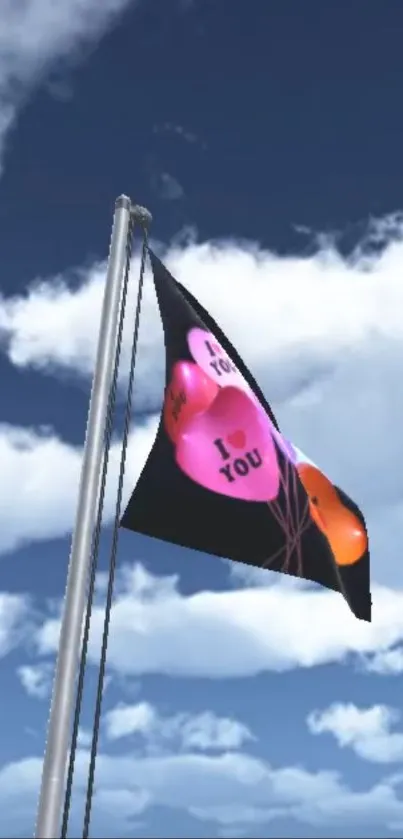 Heart flag flies against blue sky with clouds.