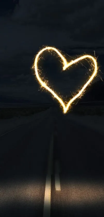 Heart-shaped spark on a dark road with a night sky background.