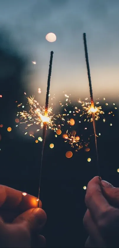 Two hands holding sparklers in a dark, romantic evening setting.