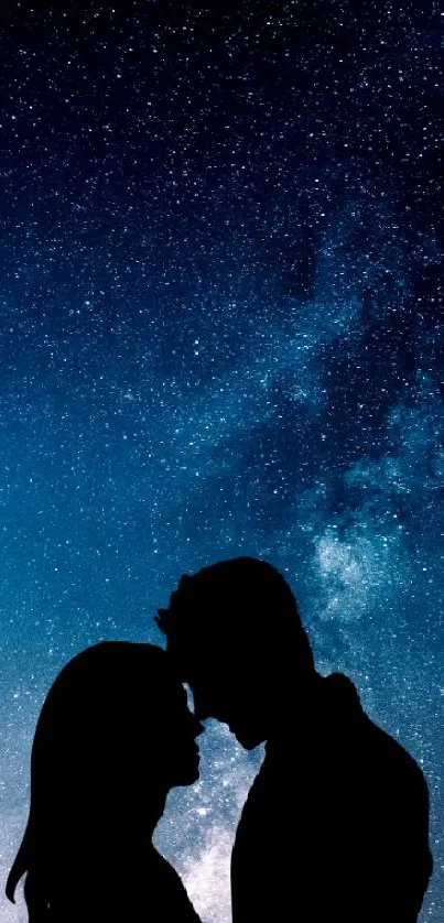 Silhouette of a couple under the starry night sky.