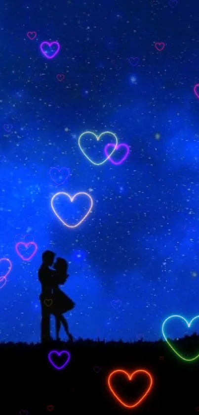 Silhouetted couple under a starry blue night sky.