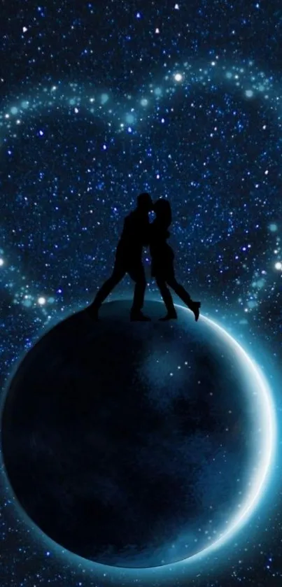 Couple silhouette on glowing planet against starry night sky.