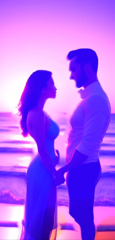 Silhouette of couple at sunset on the beach, with vibrant colors.