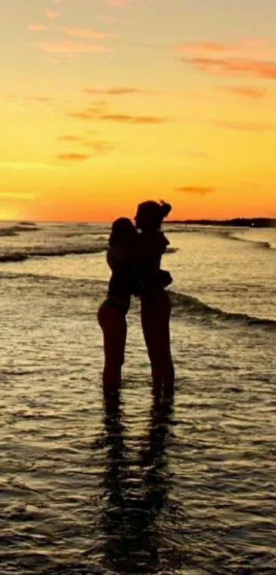 Romantic couple silhouette at sunset beach.