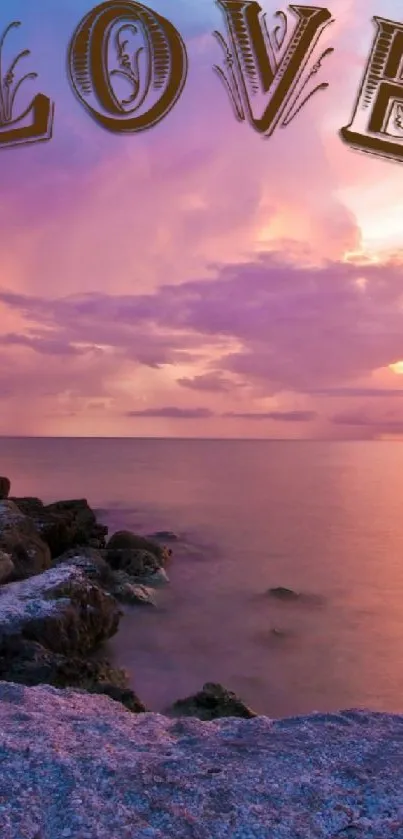 Beautiful sunset with 'LOVE' text over a rocky shoreline.