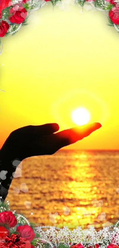 Hand holds the sun with floral frame at sunset.