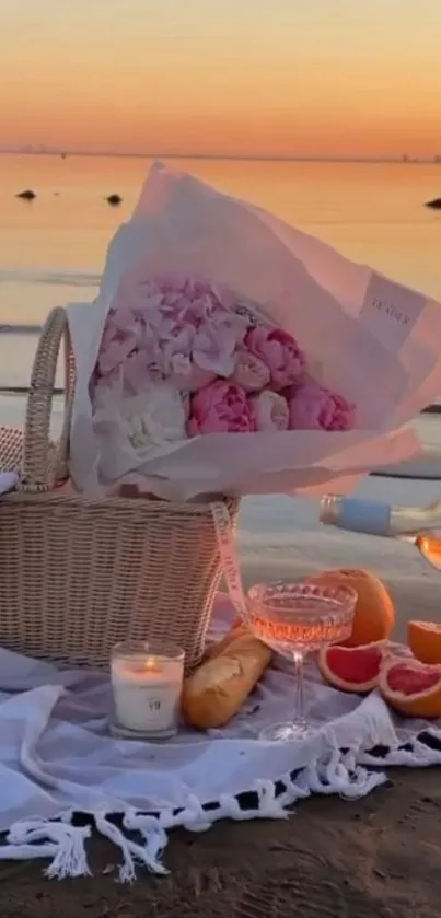 Beach picnic setup at sunset with flowers, wine, and a serene sea view.