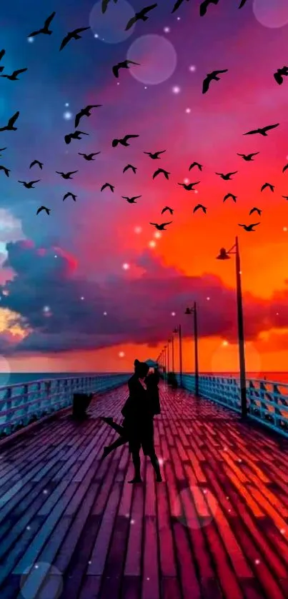 Romantic couple silhouette on sunset pier with colorful sky and birds.