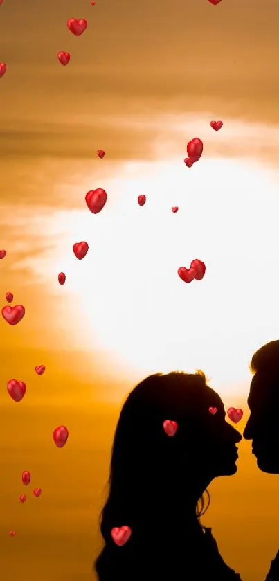 Silhouette of a couple kissing against a golden sunset background.