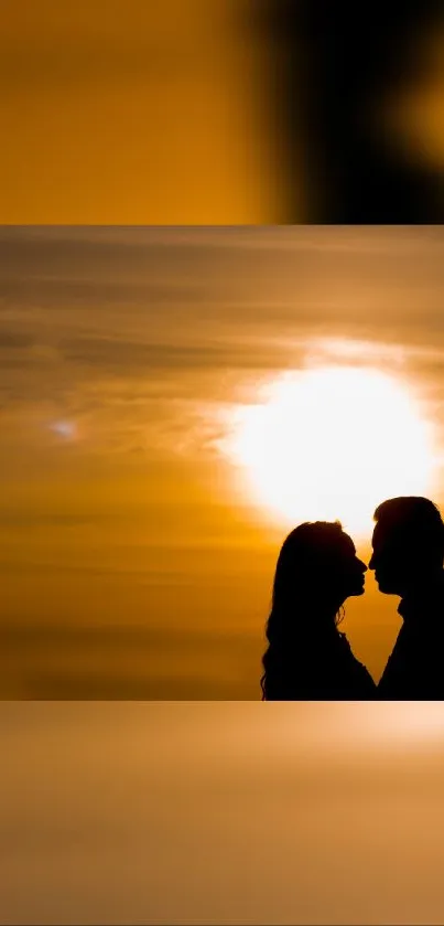 Silhouette of a couple kissing at sunset with orange hues.