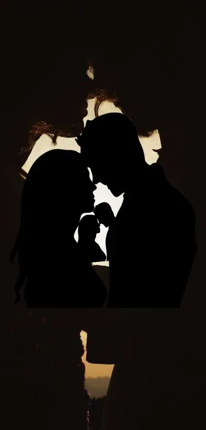 Silhouette of a couple embracing at sunset.