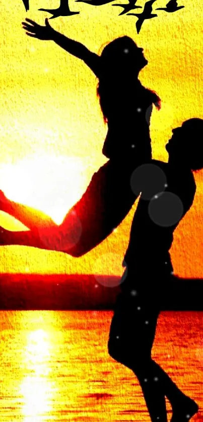 Silhouette of a couple embracing against a vibrant orange sunset backdrop.