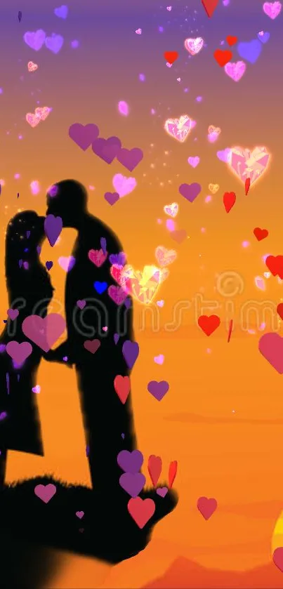 Silhouette of a couple kissing at a sunset cliff.