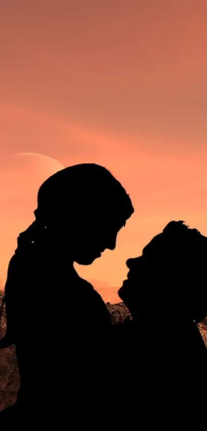 Silhouette of a couple at sunset with an orange sky and distant planet.