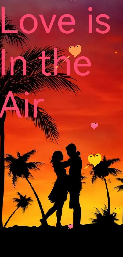 Silhouetted couple under palm trees with a vibrant orange sunset.