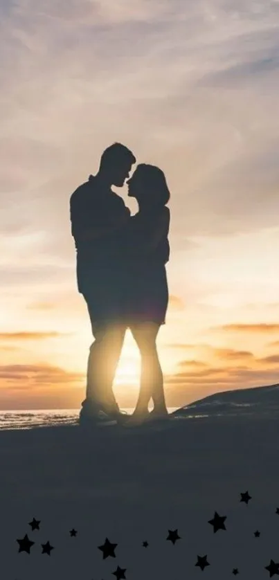 Silhouetted couple embracing at sunset by the ocean.