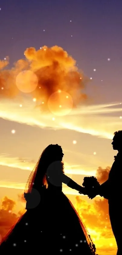Silhouette of a couple at sunset with a stunning orange sky.