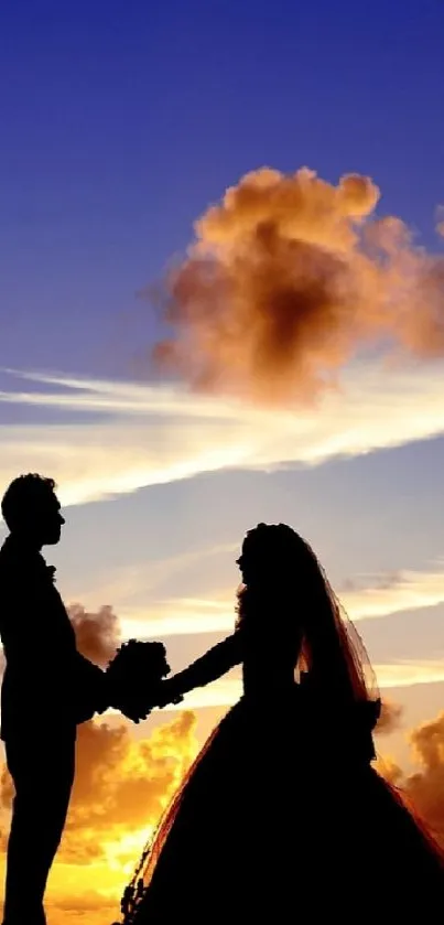 Silhouette of a couple at sunset under a colorful sky.