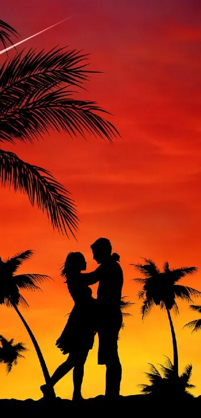 Silhouette of couple under palm trees at sunset with vibrant red and orange sky.