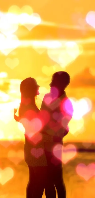 Couple silhouette with heart bokeh at sunset beach.