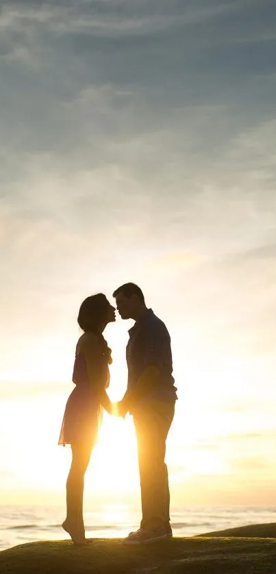 Romantic couple silhouette at sunset on a hill.