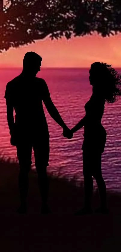 Silhouette of a couple during sunset by the ocean.