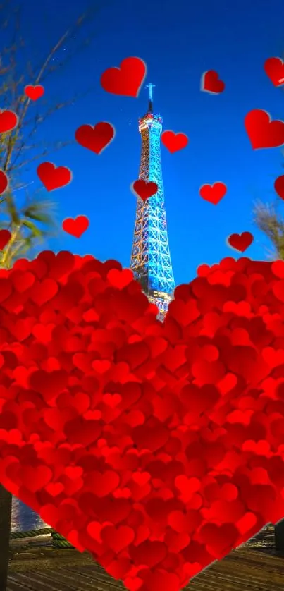 Eiffel Tower with red hearts at night.